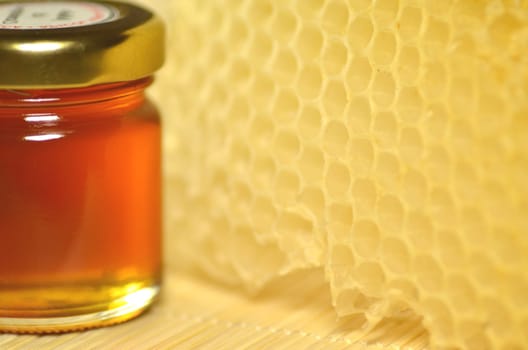 jar full of fresh delicious honey with natural honeycomb