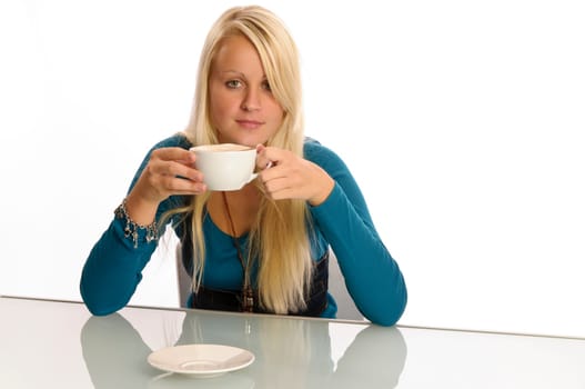 Young woman eating in front of a white background