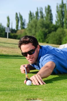 Young men play golf