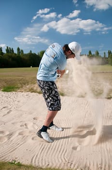 Young men play golf