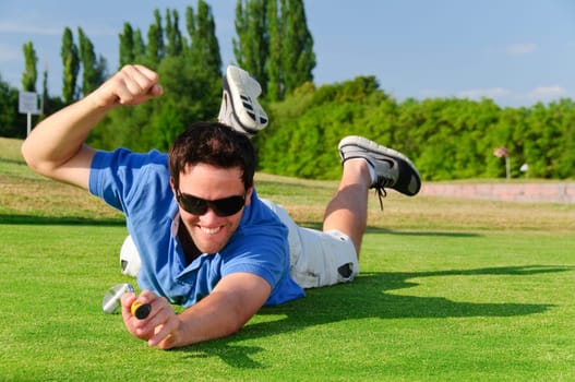 Young men play golf