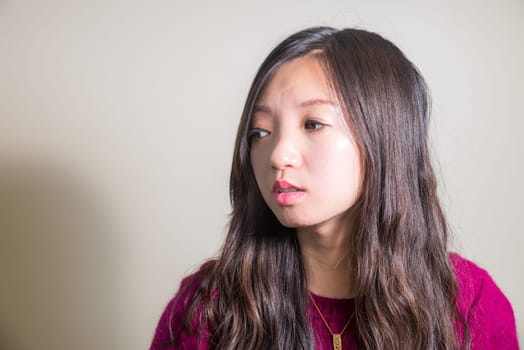 Portrait of young woman looking stressed out