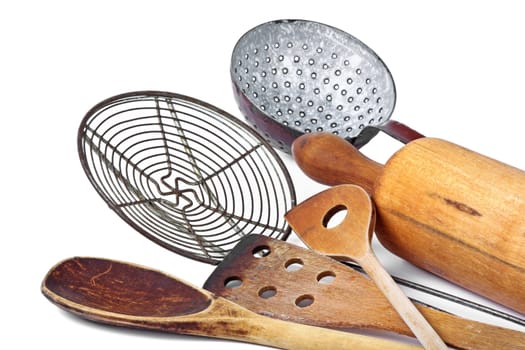 Different wooden spoons and rolling pin