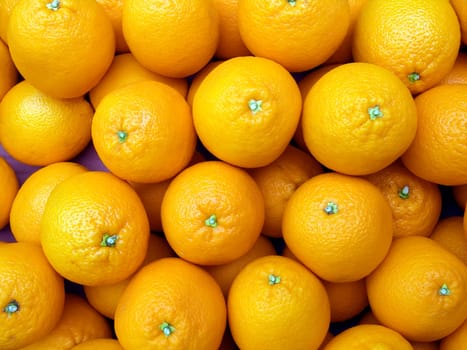 The beautiful oranges on a counter