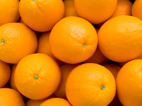 Agricultural background  a pile of beautiful oranges