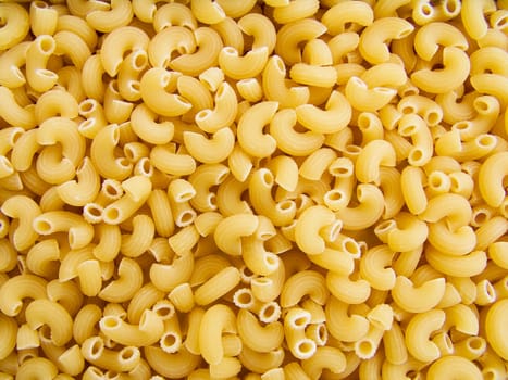 food background a pile of beautiful pasta small horns