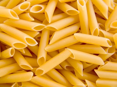 food background a pile of beautiful pasta tubules