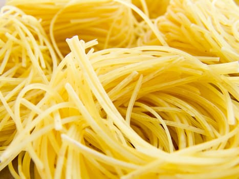 food background a pile of beautiful spaghetti nests