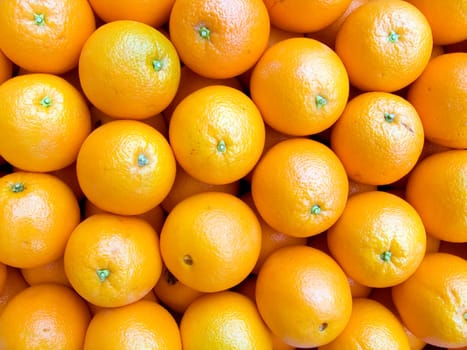 The beautiful oranges on a counter, fruit background