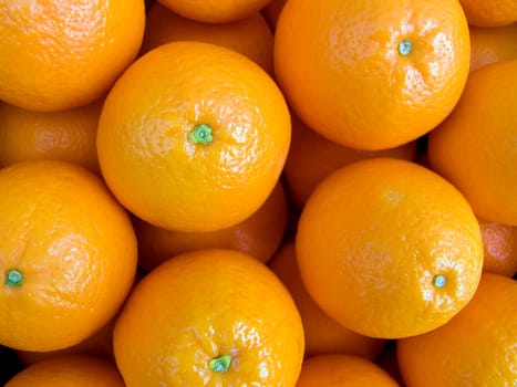 Agricultural background  a pile of beautiful oranges