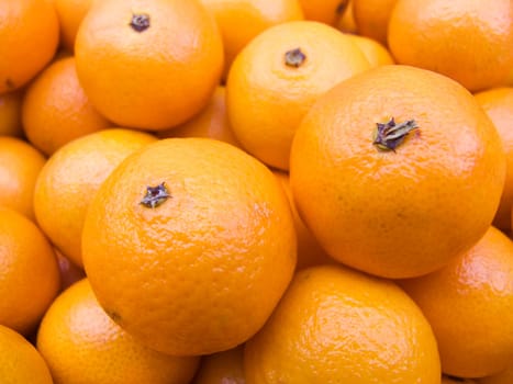 Agricultural background  a pile of beautiful tangerines