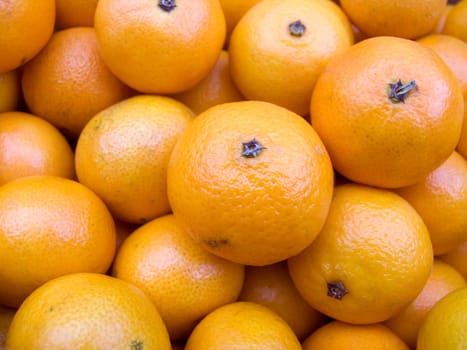 Agricultural background  a pile of beautiful tangerines
