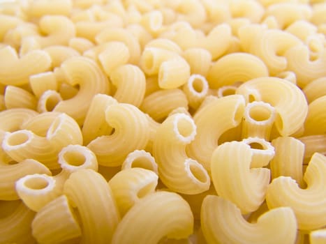 food background a pile of beautiful pasta small horns