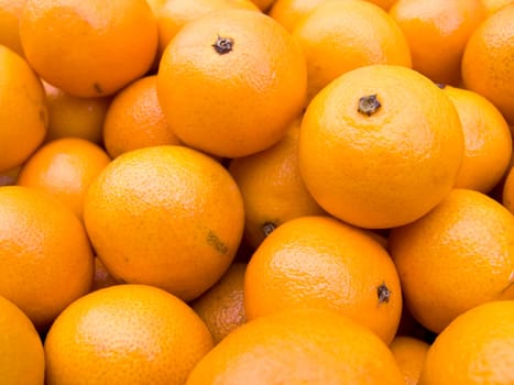 Agricultural background  a pile of beautiful tangerines