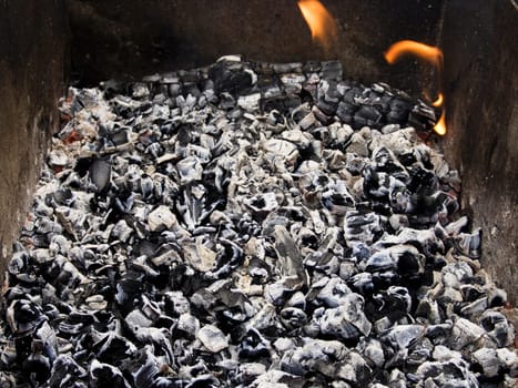 The firewood burning for cooking grill or barbecue