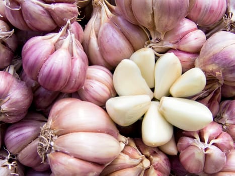 Agricultural background, a pile of beautiful cleared garlic