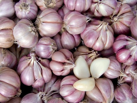 Agricultural background, a pile of beautiful garlic