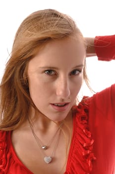 Young woman wears jeans,red clothes and a handbag against a white background