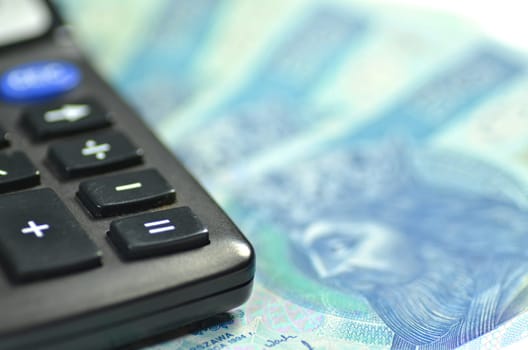 zloty banknotes from Poland and calculator