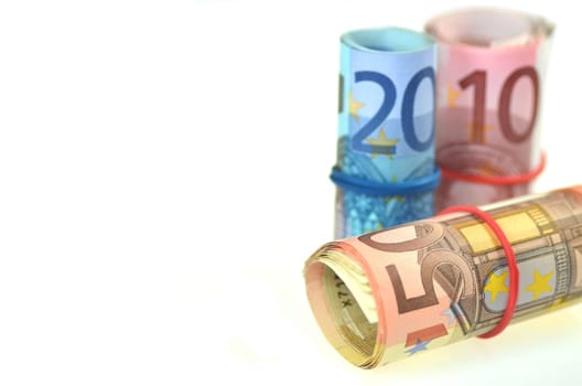 rolls of euro banknotes isolated on white