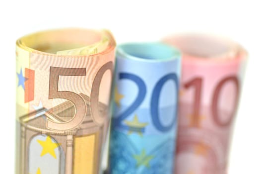 rolls of euro banknotes isolated on white