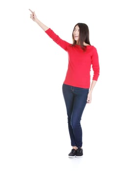 Happy , excited young woman pointing on copy space, isolated on white