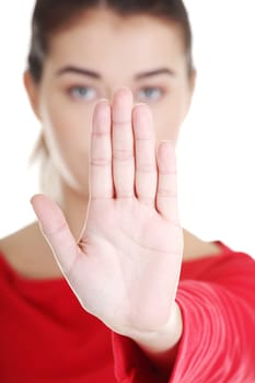 Confident woman making stop gesture sing with hand