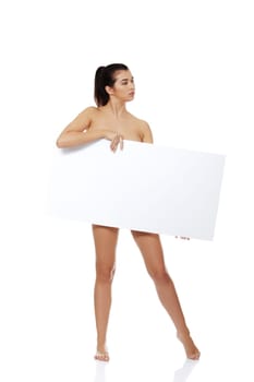 Sexy naked brunette holding empty board , isolated on white.