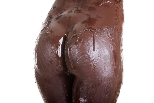Naked female body covered with chocolate, isolated on white