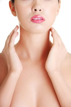 Beautiful sensual young woman touching her neck, isolated on white