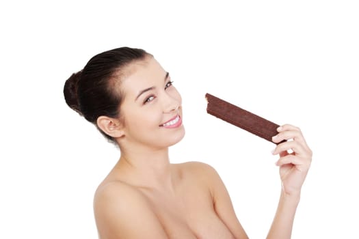 Pretty happy smiling woman eating chocolate waffle, isolated on white