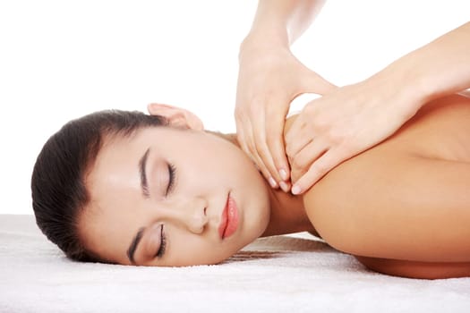Preaty young woman relaxing beeing massaged in spa saloon