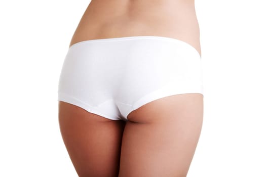 Slim tanned woman's body. Isolated over white background.