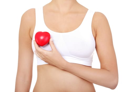 Fit female torso in white sport bra with red heart shaped toy