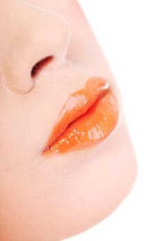 Beautiful glossy, orange woman lips, isolated on white