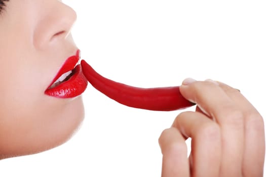 Beautiful woman lips with hot paprika, isolated on white