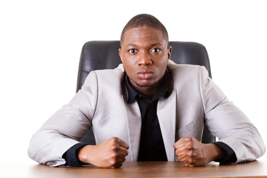 male businessman sitting in a chair,angry. madness. isolated on white.