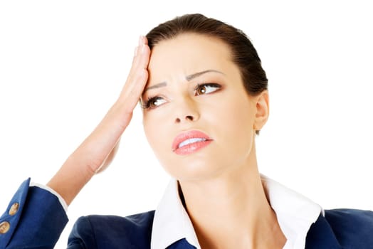 attractive businesswoman with a headache. isolated on white.