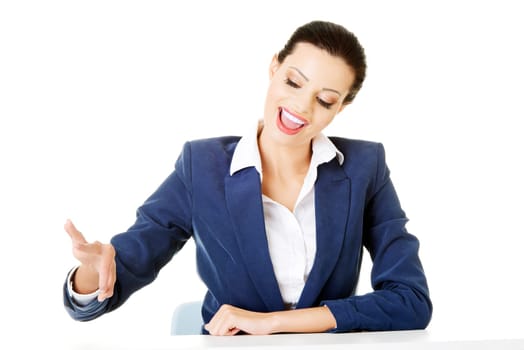 attractive woman holding a copy space in the air. isolated on white.