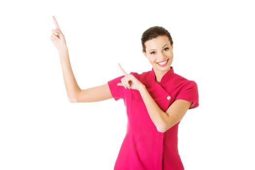 attractive woman pointing up. isolated on white.