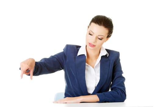 attractive woman holding copy space in the air. isolated on white.