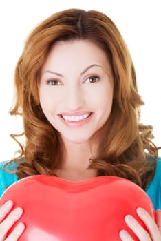 attractive casual woman holding a baloon heart. isolated on white.