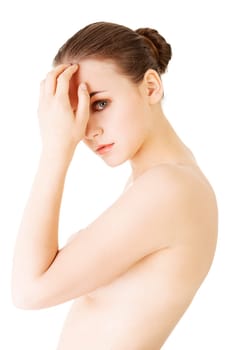 naked attractive woman touching her forehead. isolated on white.