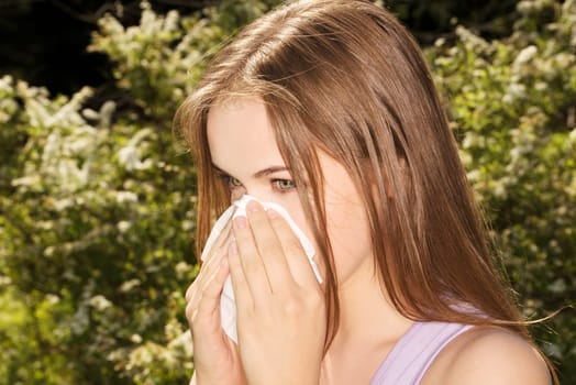 attractive young woman outdoor with white tissue.