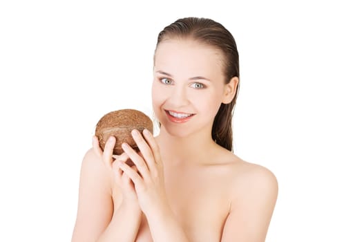 attractive naked young woman holding a coconut. isolated on white.