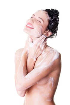 young fit woman in shower washing her body. isolated on white.