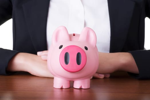 close up on a piggy-bank put on the table.