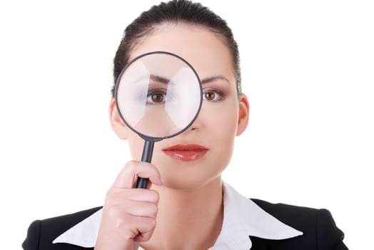 business woman looking through a magnifying glass. isolated on white.