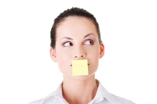 attractive woman's face with empty card on lips. isolated on white.