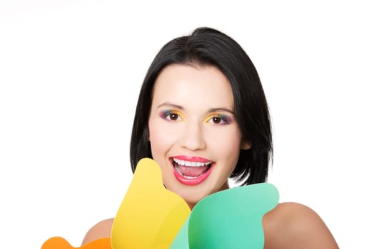 attractive young woman smiling with colorful makeup and windmill. isolated on white.